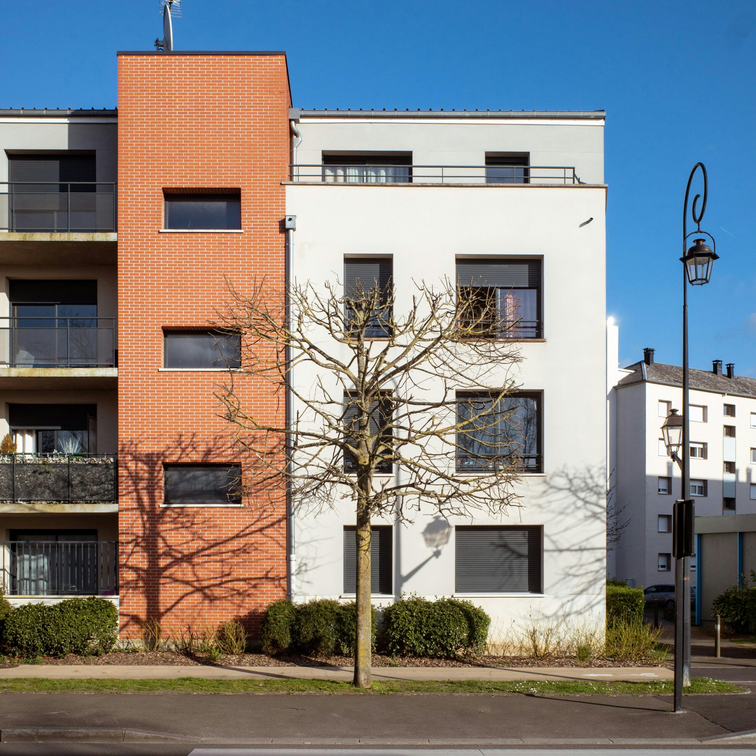 A contemporary apartment building in Compiègne, France, showcasing urban architecture and design.